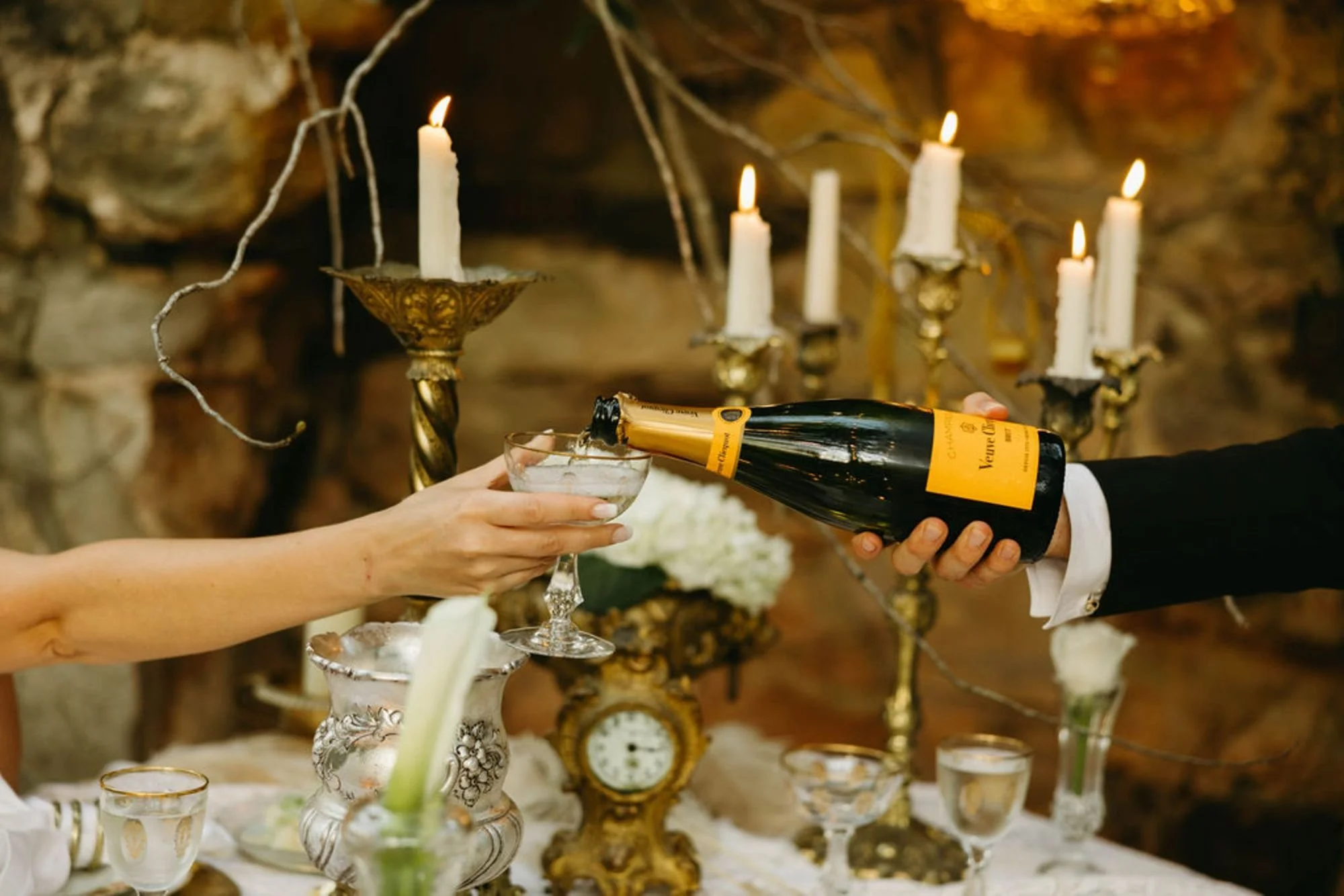 Bride and groom toasting at their Savannah wedding, planned by Port Town Collective
