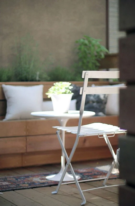 And a playful wooden swing hung from the large tree.