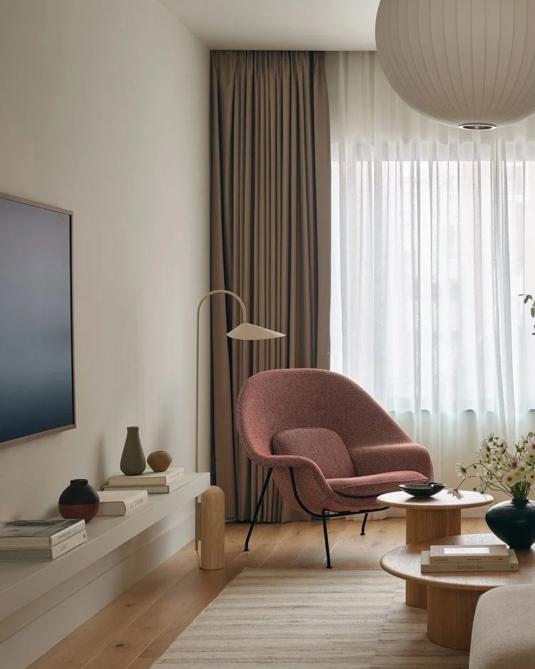 The living room at Java Haus, Greenpoint &mdash; where rigorous performance meets a warm, restrained interior.
.
Nelson Ball Pendant overhead. Muuto In Situ sofa. Saarinen Womb Chair in Kvadrat Sahco Safire fabric. Ben Soleimani Alterno rug underfoot
