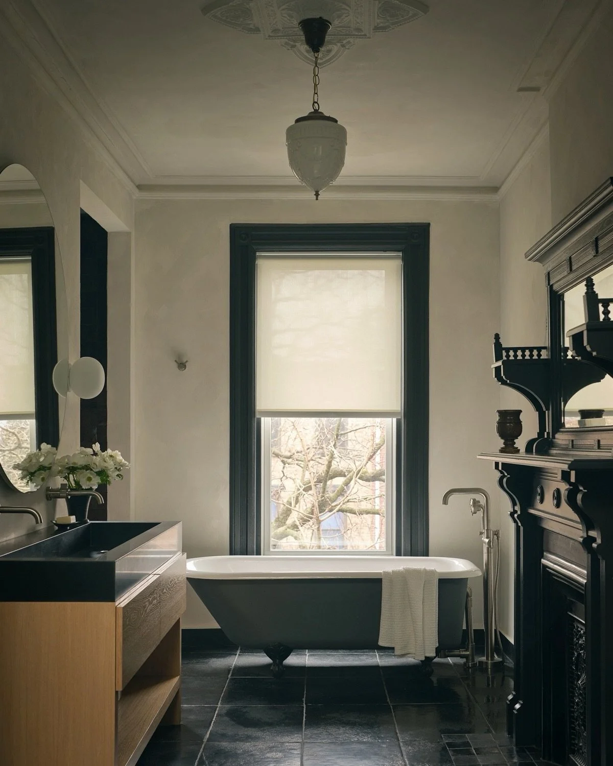 At the Oculus House, old and new are deliberately held in tension&mdash;making the historic details feel even more present. The primary bath pairs restored original woodwork with a contemporary walk-in shower and cedar sauna.
.
Architecture &amp; Int