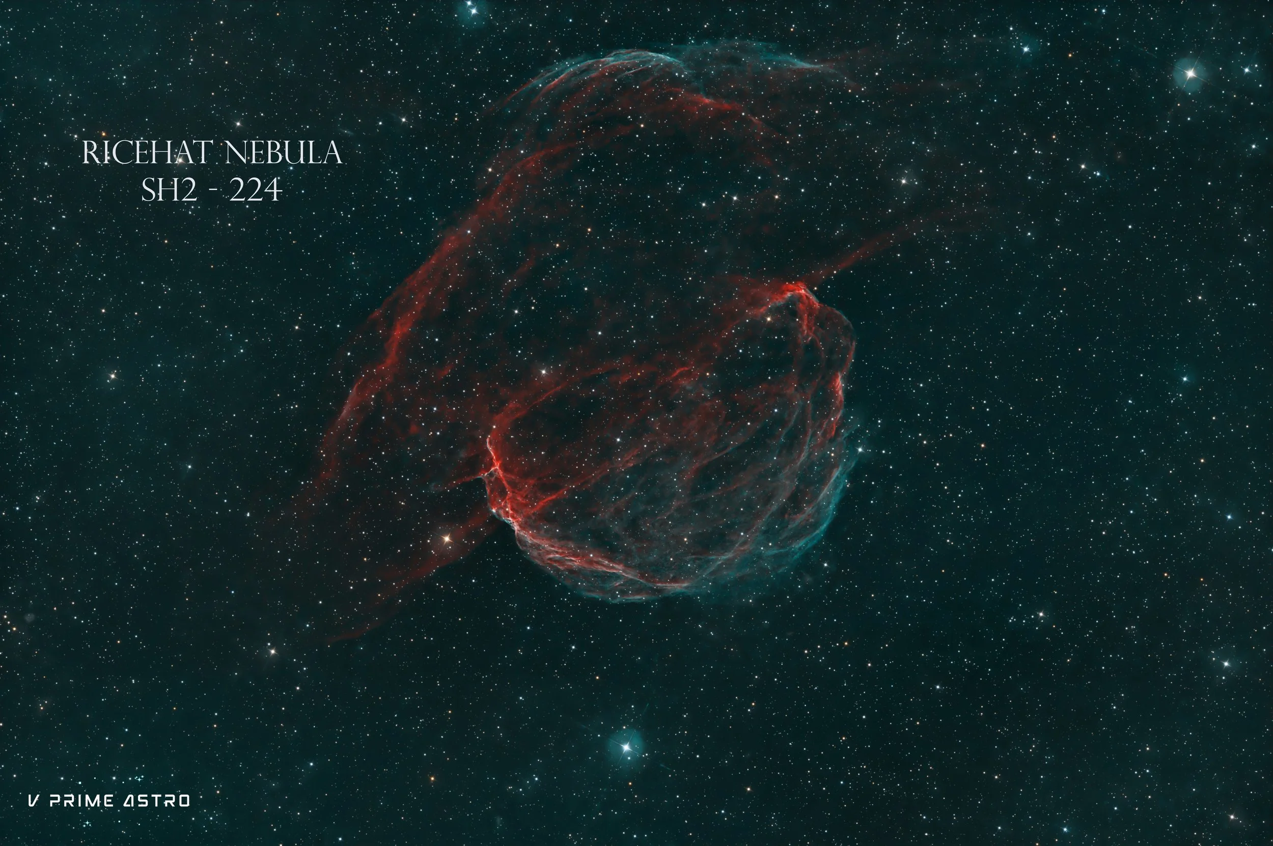 A photograph of the Richet Nebula, also known as SH2-224, showing a complex, glowing, red-tinged nebula against a star-filled backdrop with many stars of varying brightness.