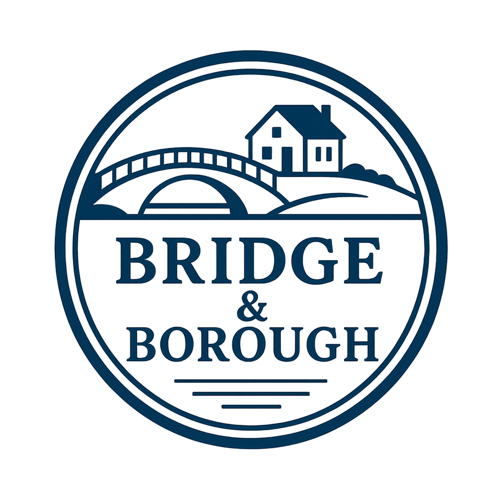 A circular logo with a depiction of a bridge, house, and landscape, with the text 'Bridge & Borough' inside.