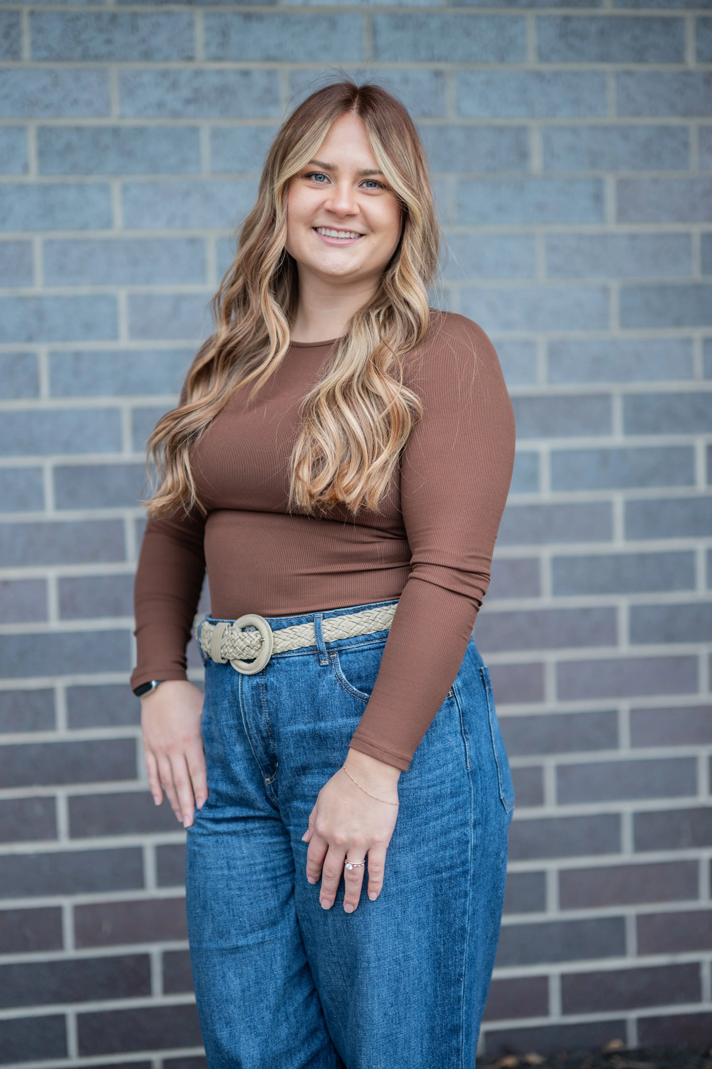 A woman smiling.