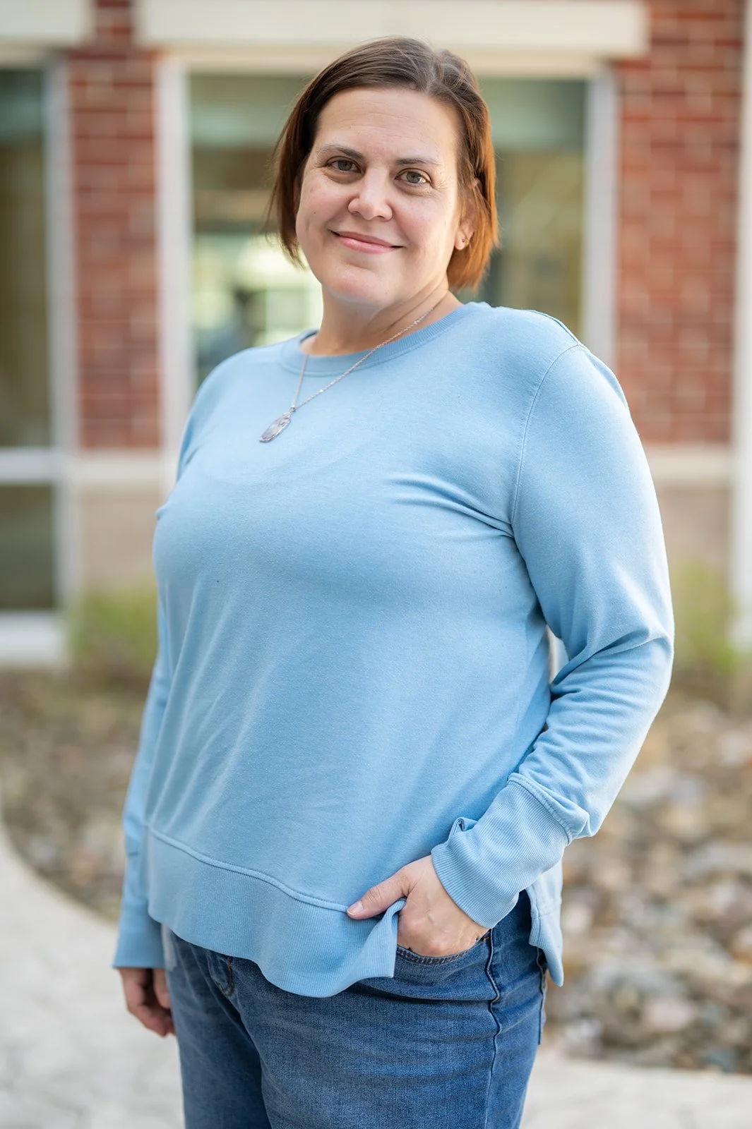 A woman smiling.