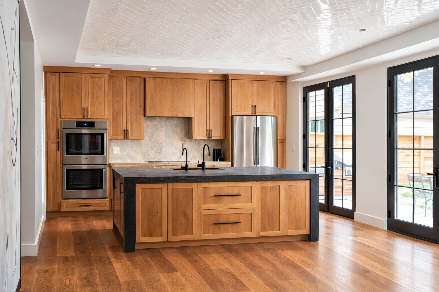 Kitchen - Artisan Oyster - polished ceiling tile, white oak cabinetry, white oak hand-sawn wood flooring, Wolf induction 36" cooktop, Bosch dual oven and refrigerator, imported custom Rubinet faucets, Taj Mahal Quartzite with hidden in-wall spice rac