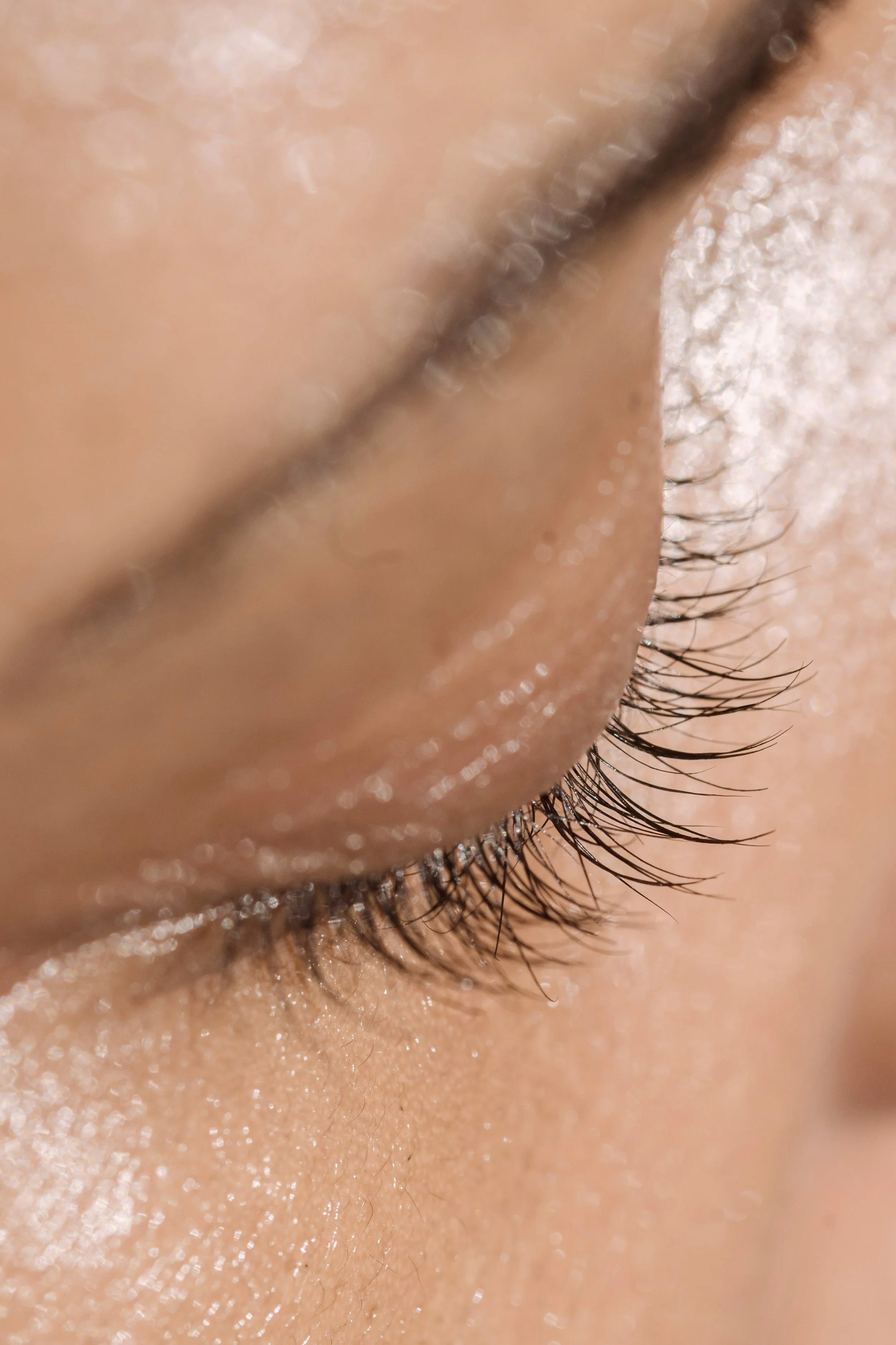 closeup of woman's eyelashes, facial waxing near me