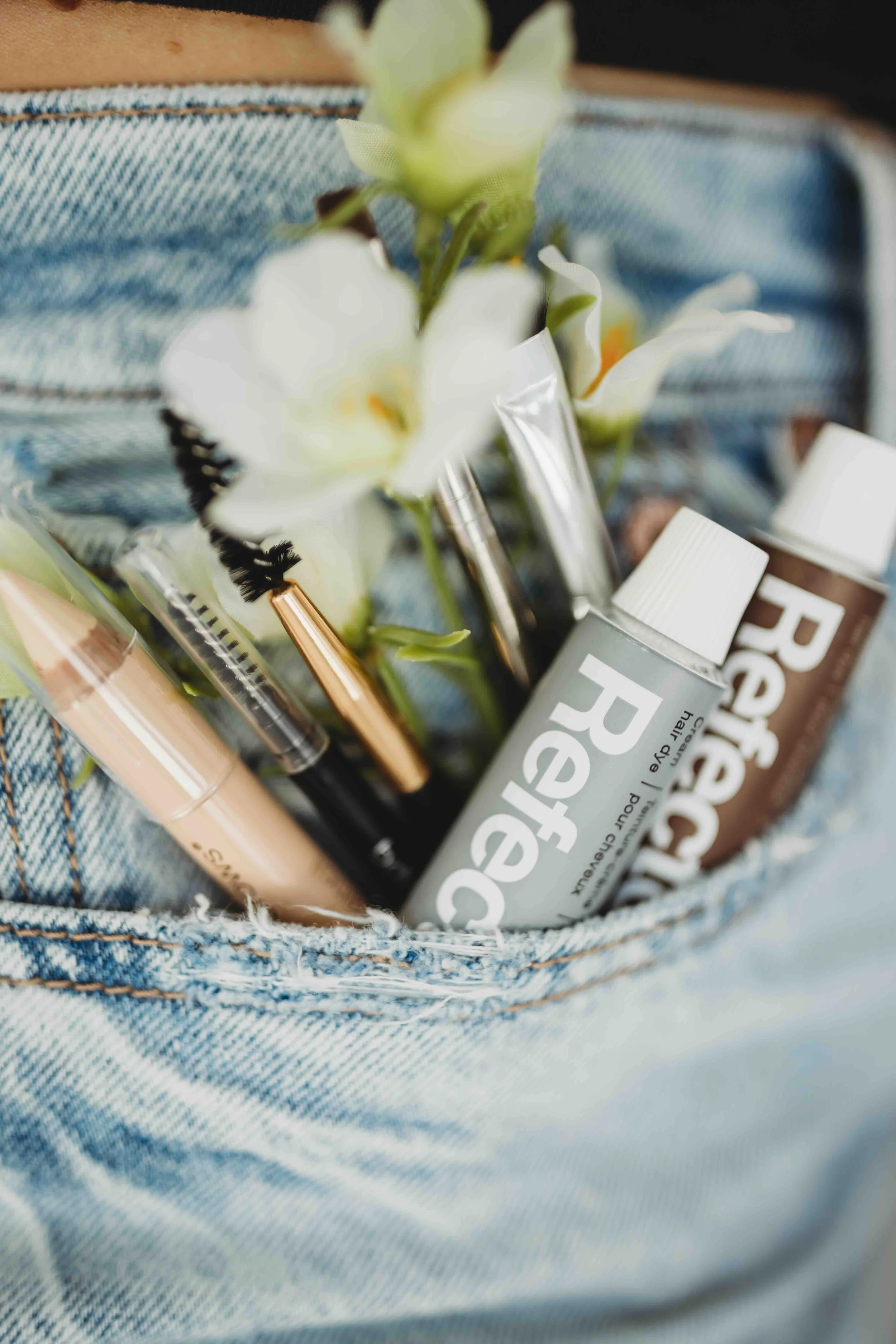 skincare products and flower motif, lash and brow services near me