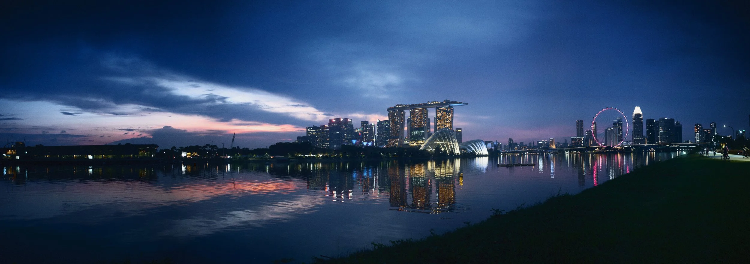 Marina Bay Sans and Flower domes during last light across the marina reservoir