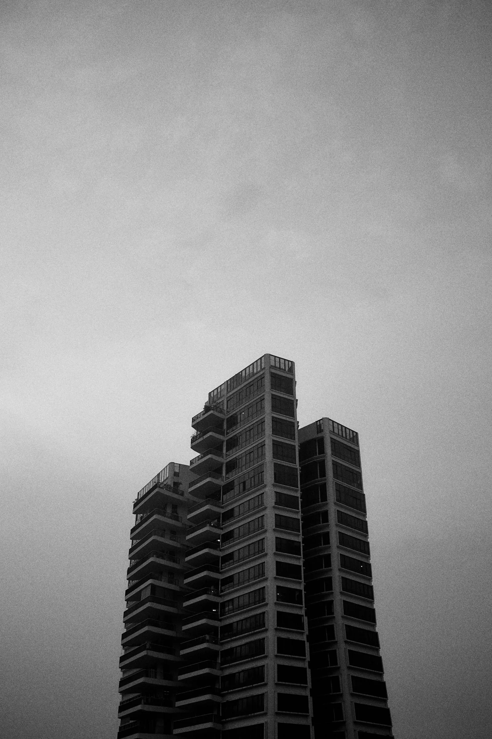 black and white image of a single tower