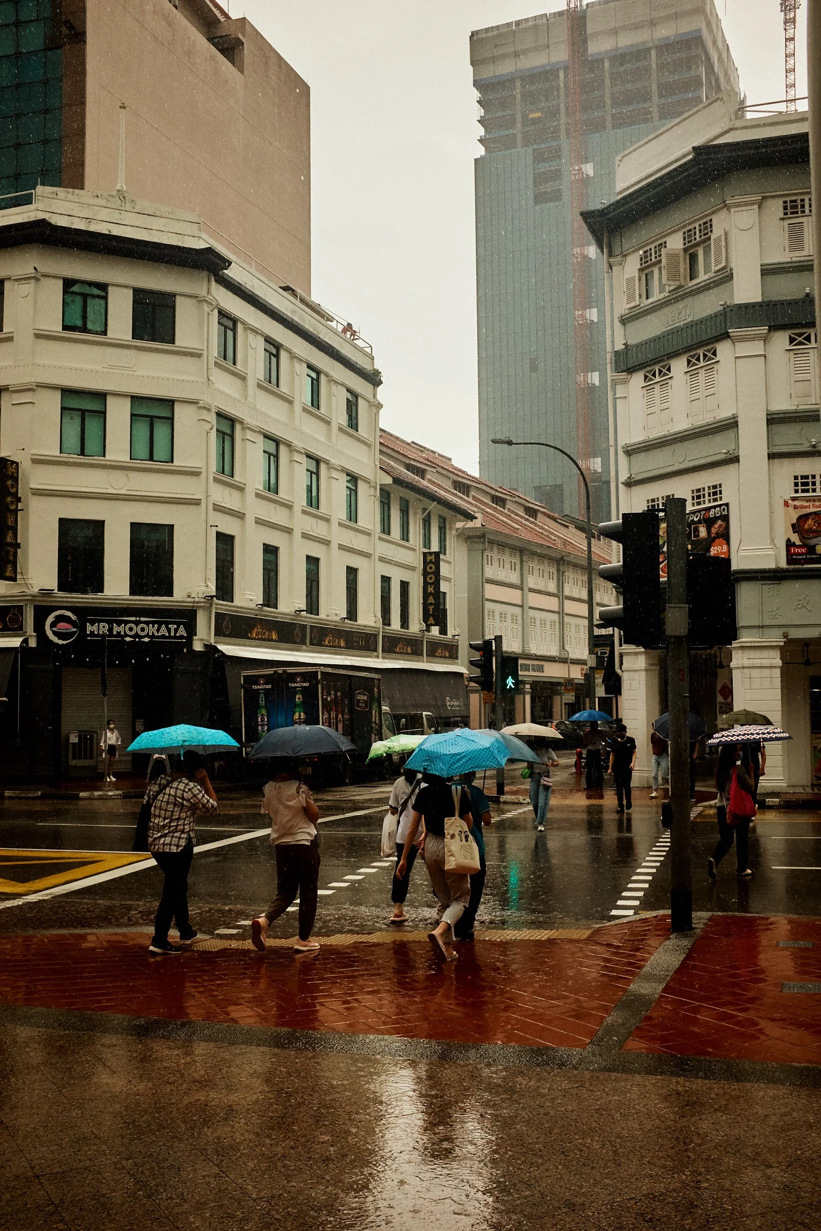 blue umbrellas during rain