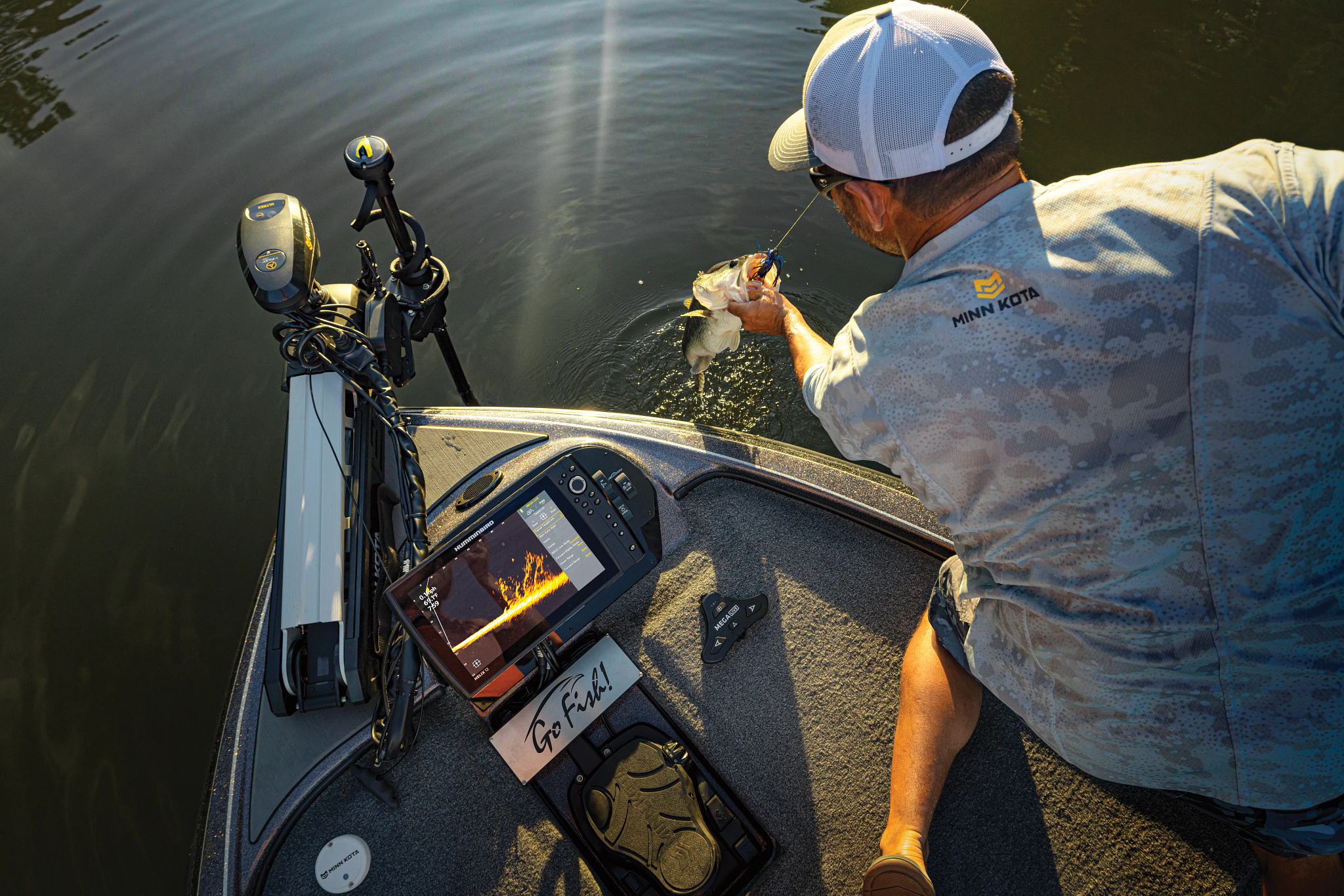 A man fishing on a boat at sunset, catching a fish with a fishing line, stereo and fishing equipment on the boat, and a handwritten note that says 'Go Fish!'