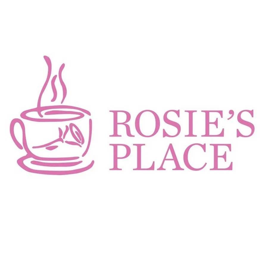 Logo for Rosie’s Place featuring a pink line drawing of a steaming coffee cup with a rose inside, accompanied by the text "ROSIE'S PLACE" in pink.