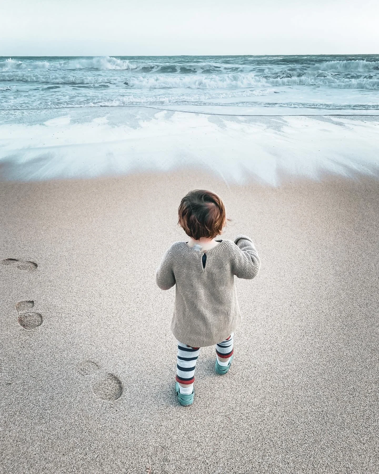 First steps on the sandy stores of the homeland on a warm Cornish day while eating biscuits and digging holes with pebbles. A quiet beach in the sun with just the Atlantic waves for company and a toddler who didn&rsquo;t want to leave. A day for the 