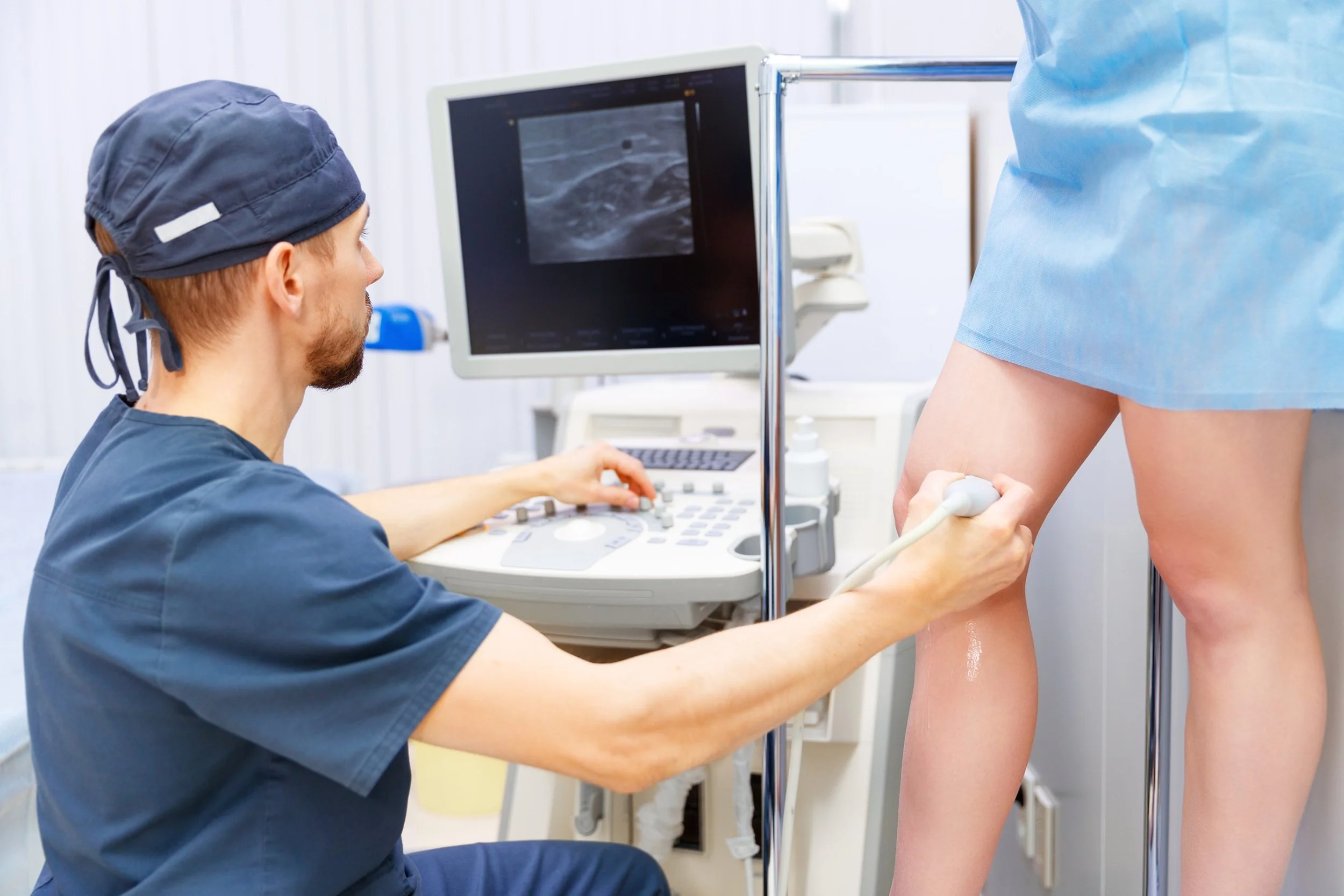 Doctor examines leg minutes after treatment