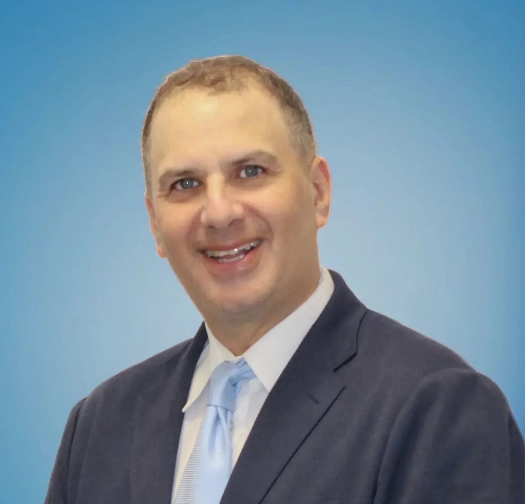 Mark Blue Background Cropped.jpeg