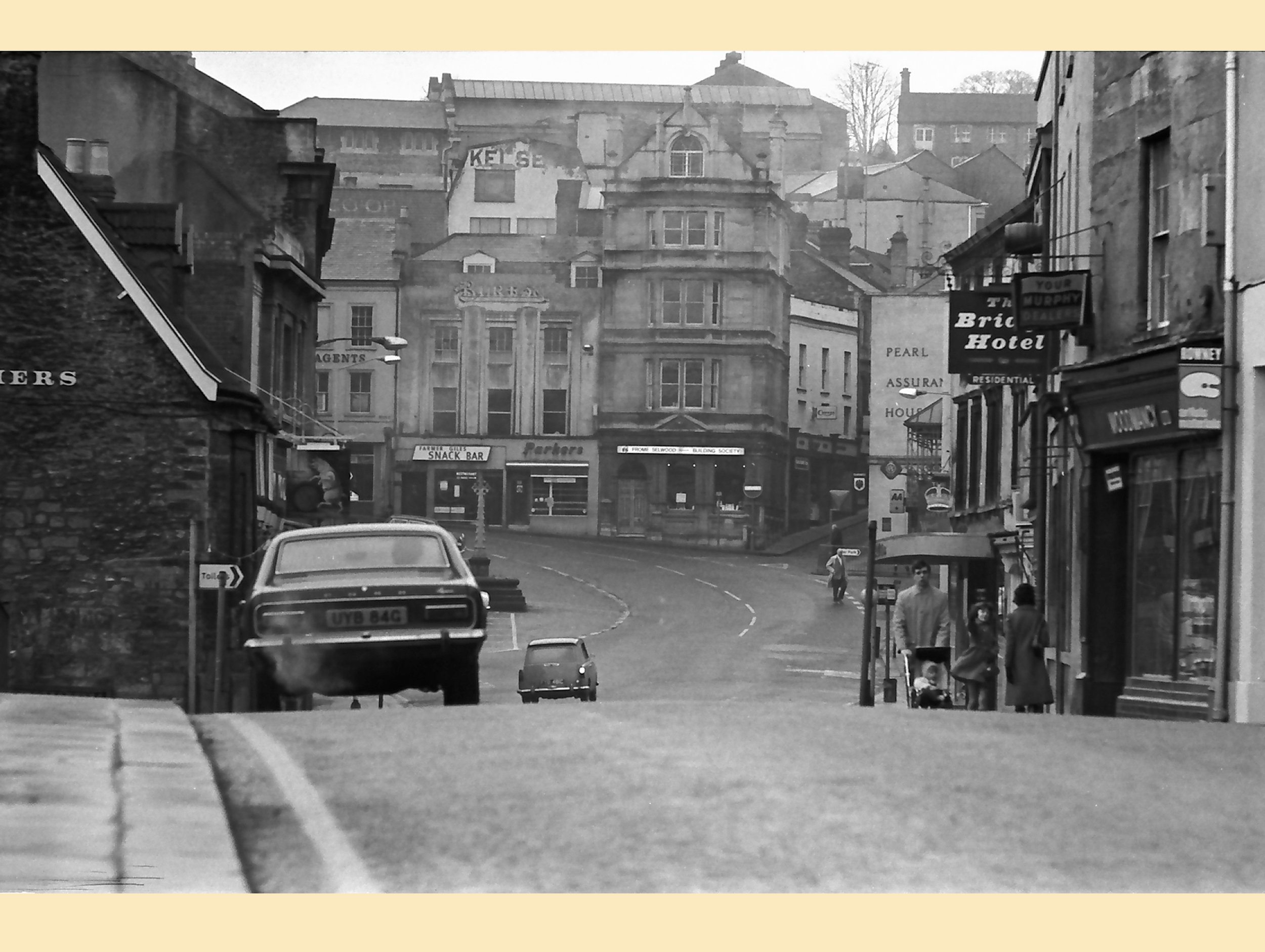  VIEW OF THE MARKET PLACE FROM THE BRIDGE -  
The sign for the Bridge Hotel can be seen and to the right of that, Woodmancy's electrical shop.
