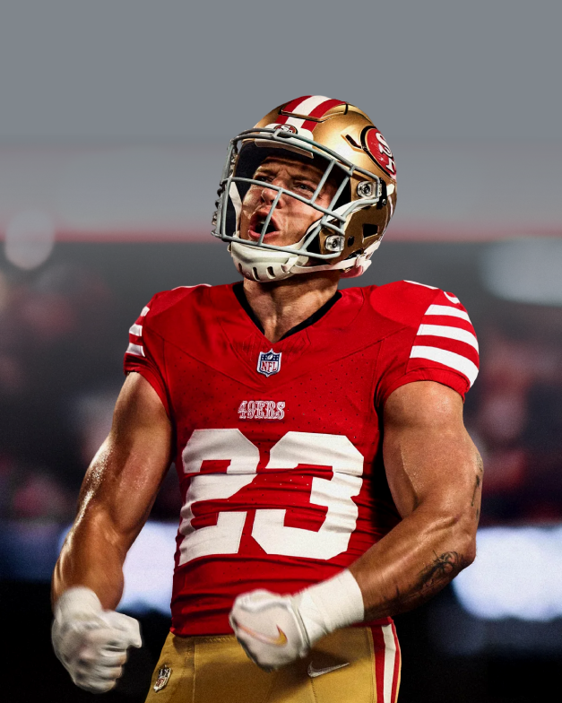 A football player in a red and gold San Francisco 49ers uniform and helmet, celebrating on the field.