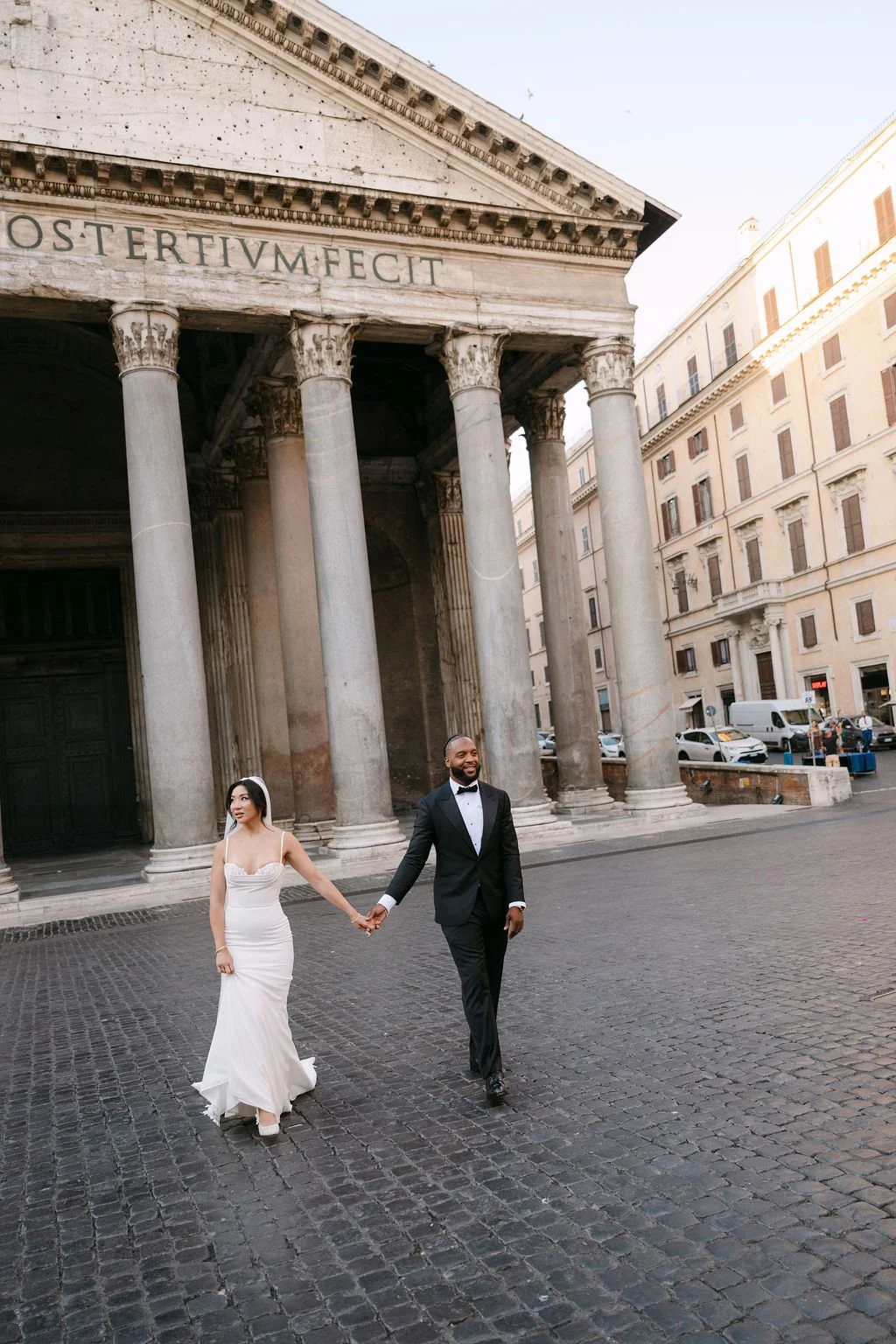 sarapaolucci-bride-and-groom-walking-away-from-pantheon-rome.jpg