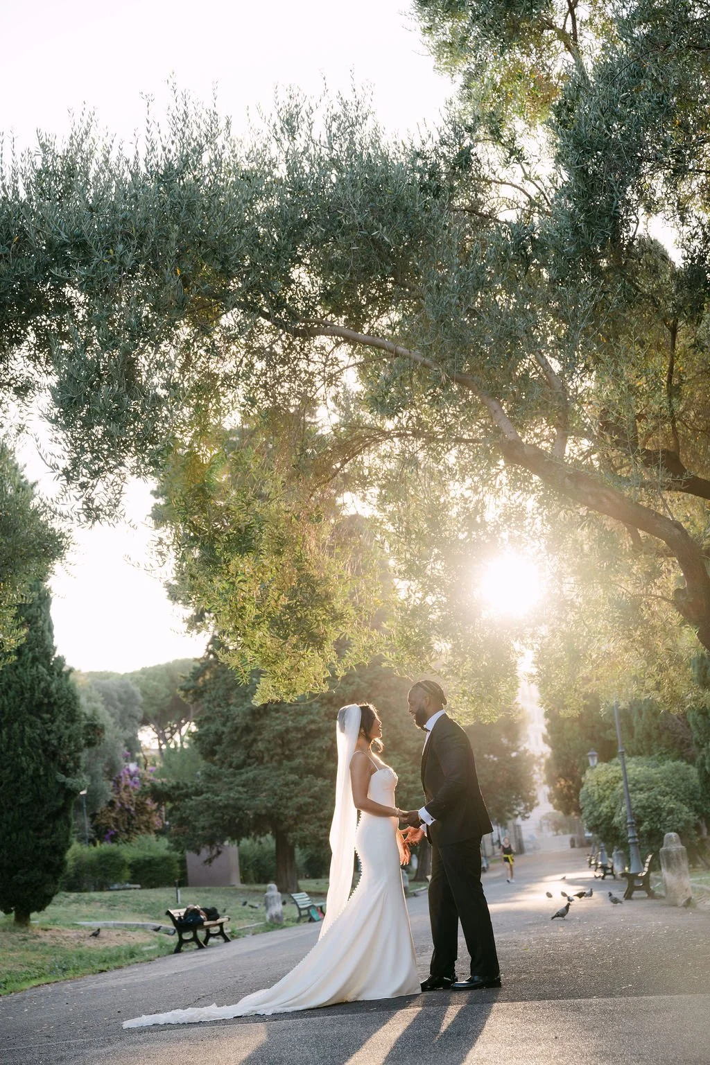 sarapaolucci-bride-and-groom-holding-hands-at-dawn.jpg