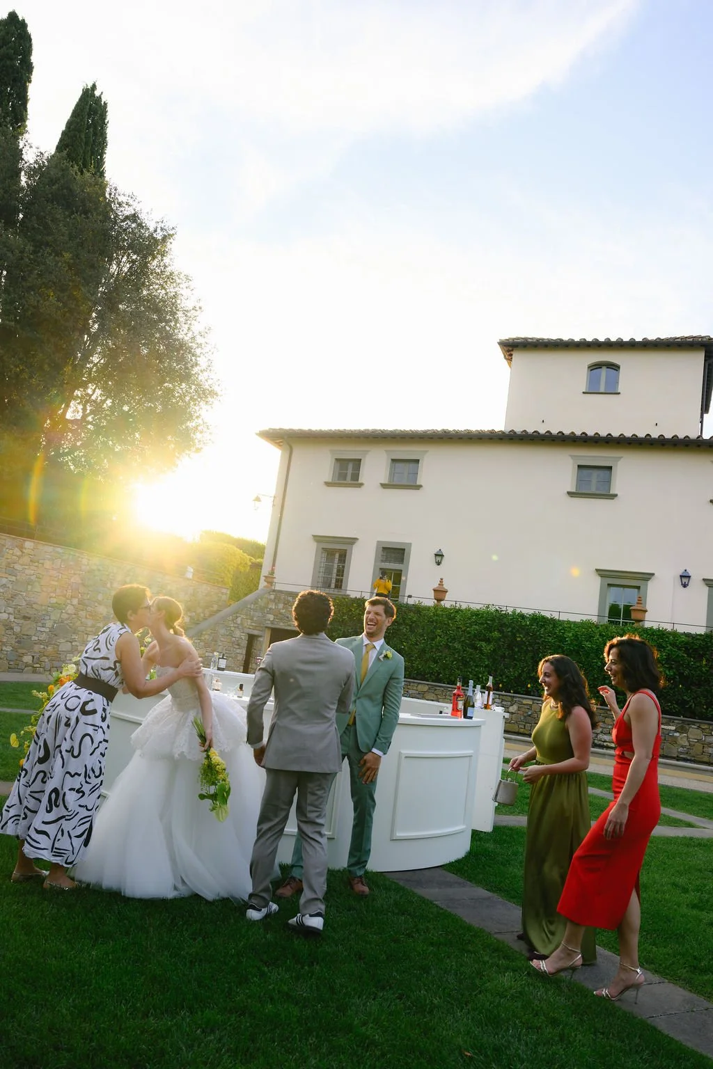 sarapaolucci-bride-and-groom-celebrating-with-friends.jpg