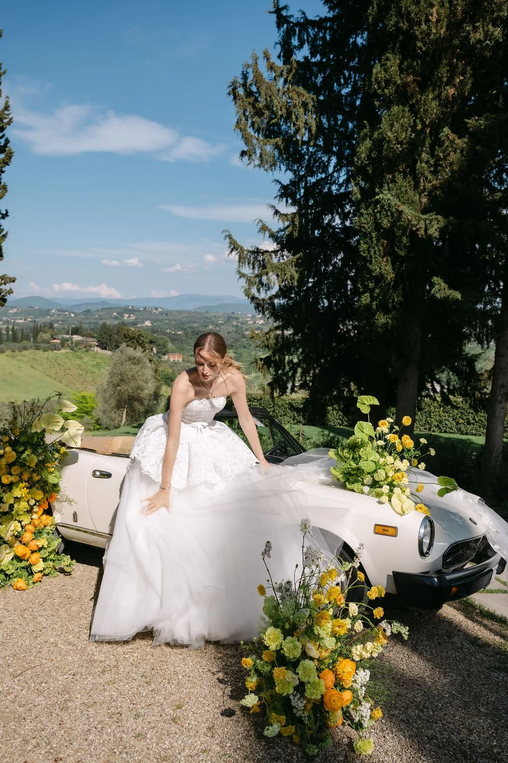 sarapaolucci-bride-playing-with-wedding-dress.jpg