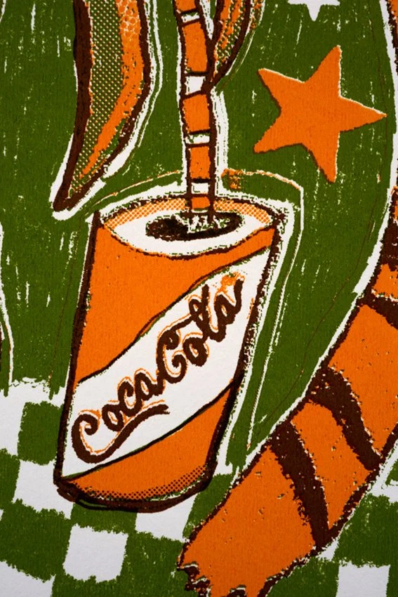 Closeup of tin can graphic artwork of a tiger and printed "AMAZING" by Charlie-Evaristo Boyce