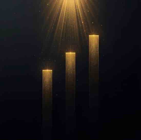 Four ascending gold-colored rectangular bars against a dark background with a bright light source shining down from above.