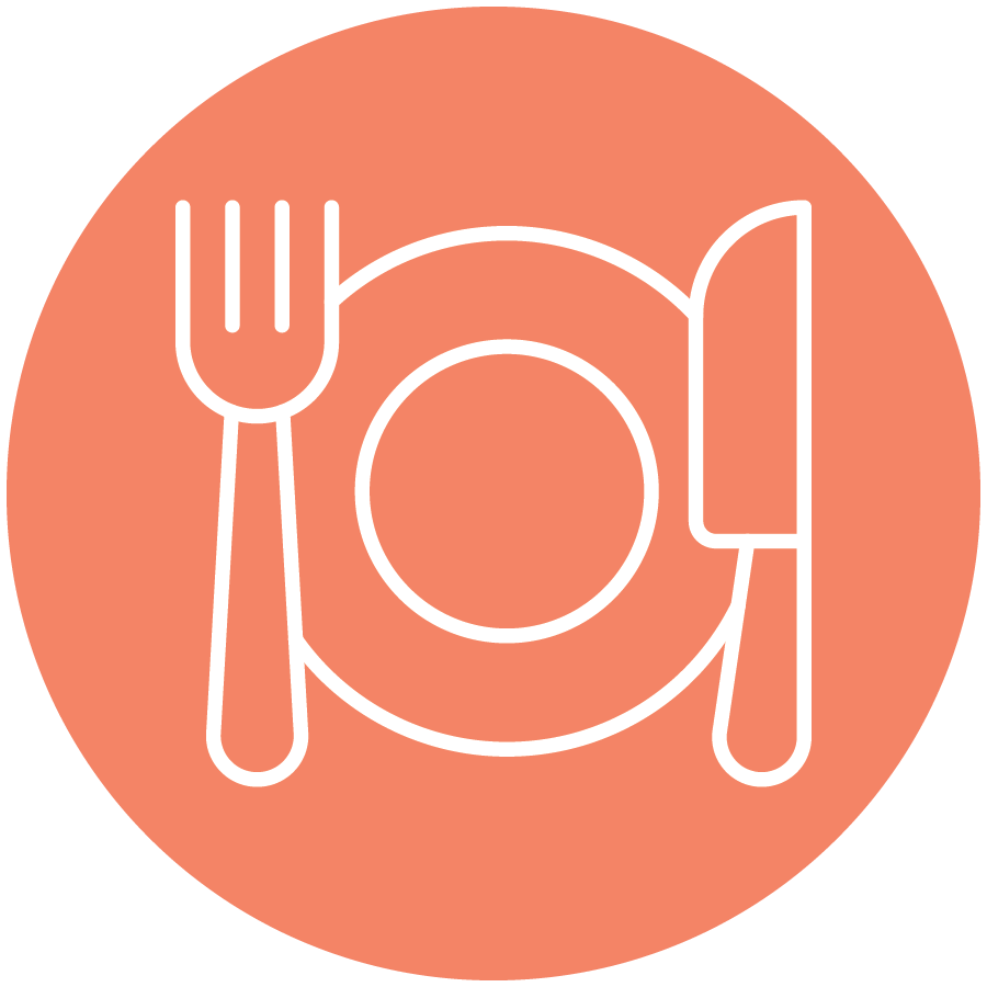 Icon of a fork, plate, and knife on an orange circular background, indicating a dining or restaurant area, suggesting a culinary-centered experience.
