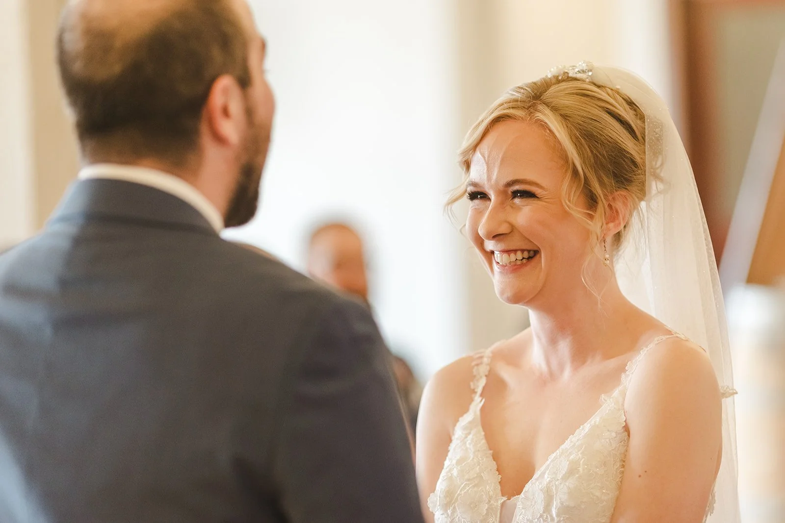 Bride laughing during wedding ceremony  Four Fathers  Cambridge, ON  Fedora Media.jpg