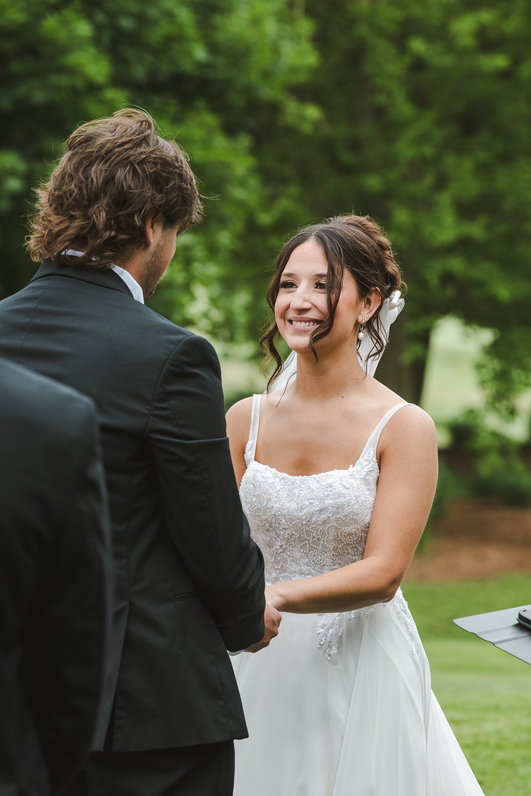 Bride smiling during ceremony  Rebel Creek  Fedora Media.jpg