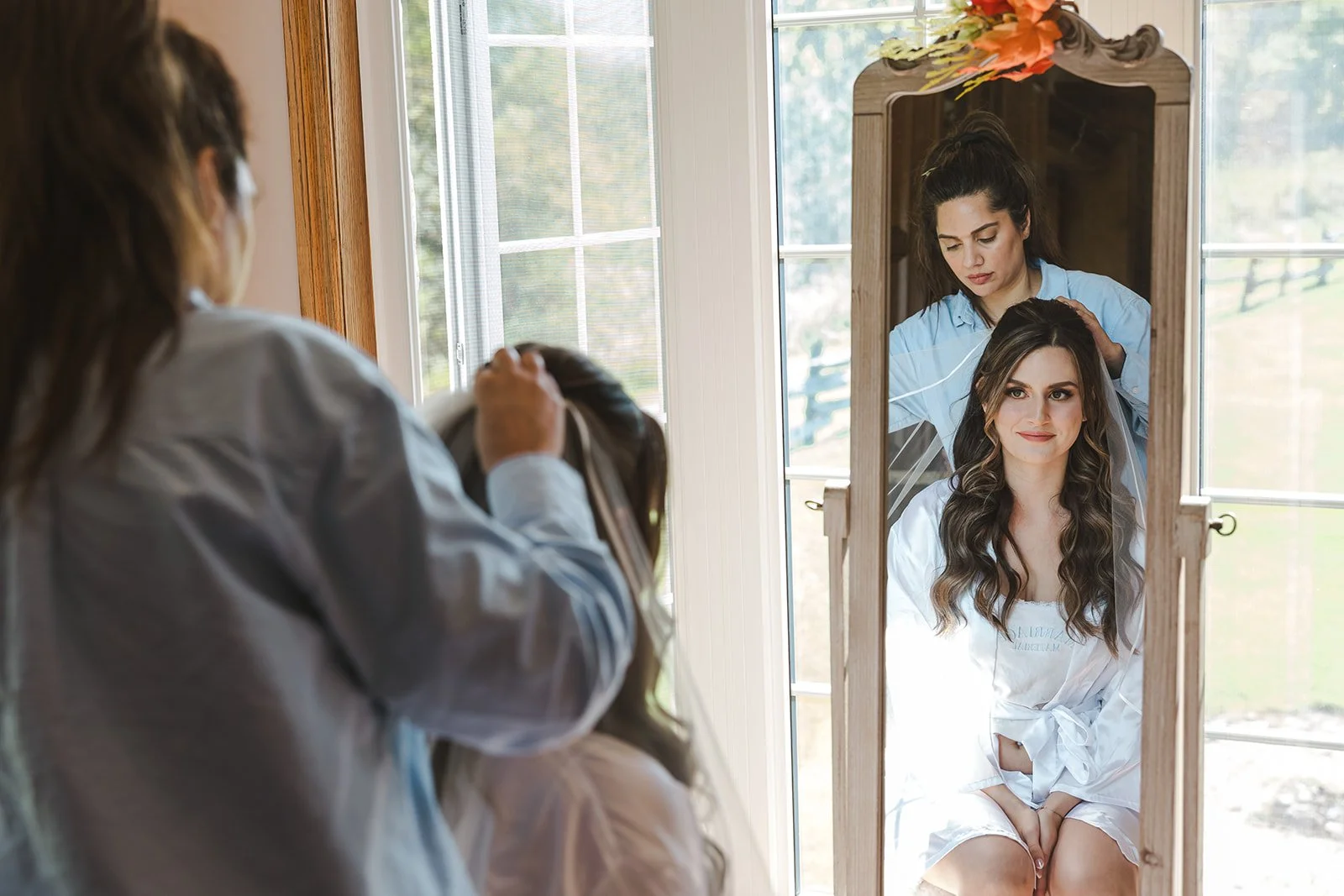Putting in bride veil  Barn Swallows at Thatcher Farm  Fedora Media.jpg