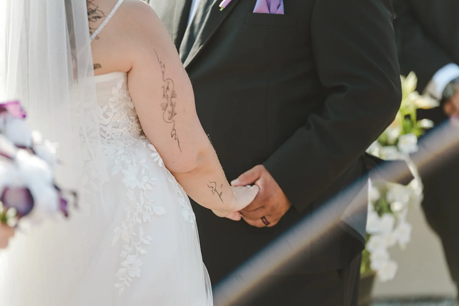 Bride and groom holding hands during wedding ceremony  Hamilton, ON  Carmen's Hotel  Fedora Media.jpg
