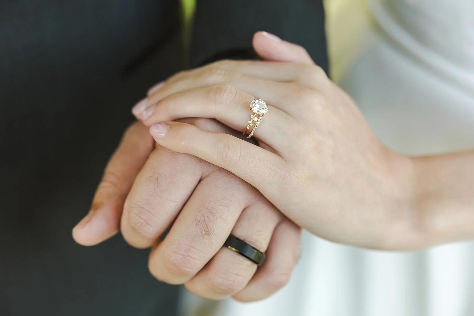 Holding hands with wedding rings Century Pines  Fedora Media.jpg