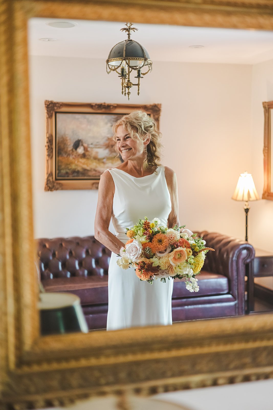 Reflection of glowing bride in mirror  Erin Estates  Fedora Media.jpg