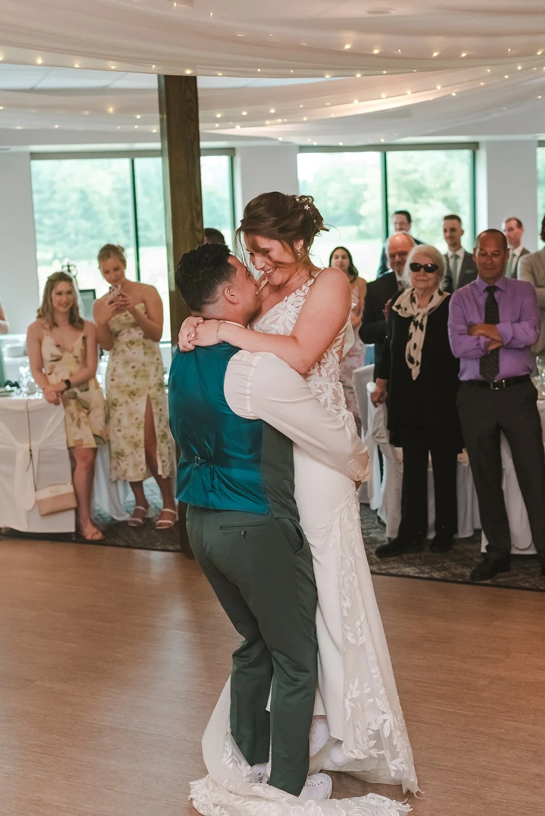 Groom lifts bride during first dance  Springfield Golf & Country Club  Fedora Media.jpg