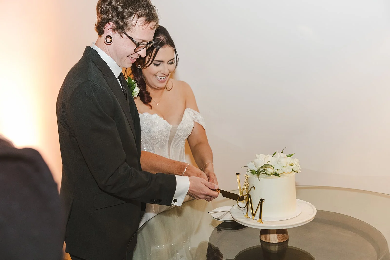Bride and groom cutting wedding cake  Erin Estates  Fedora Media.jpg