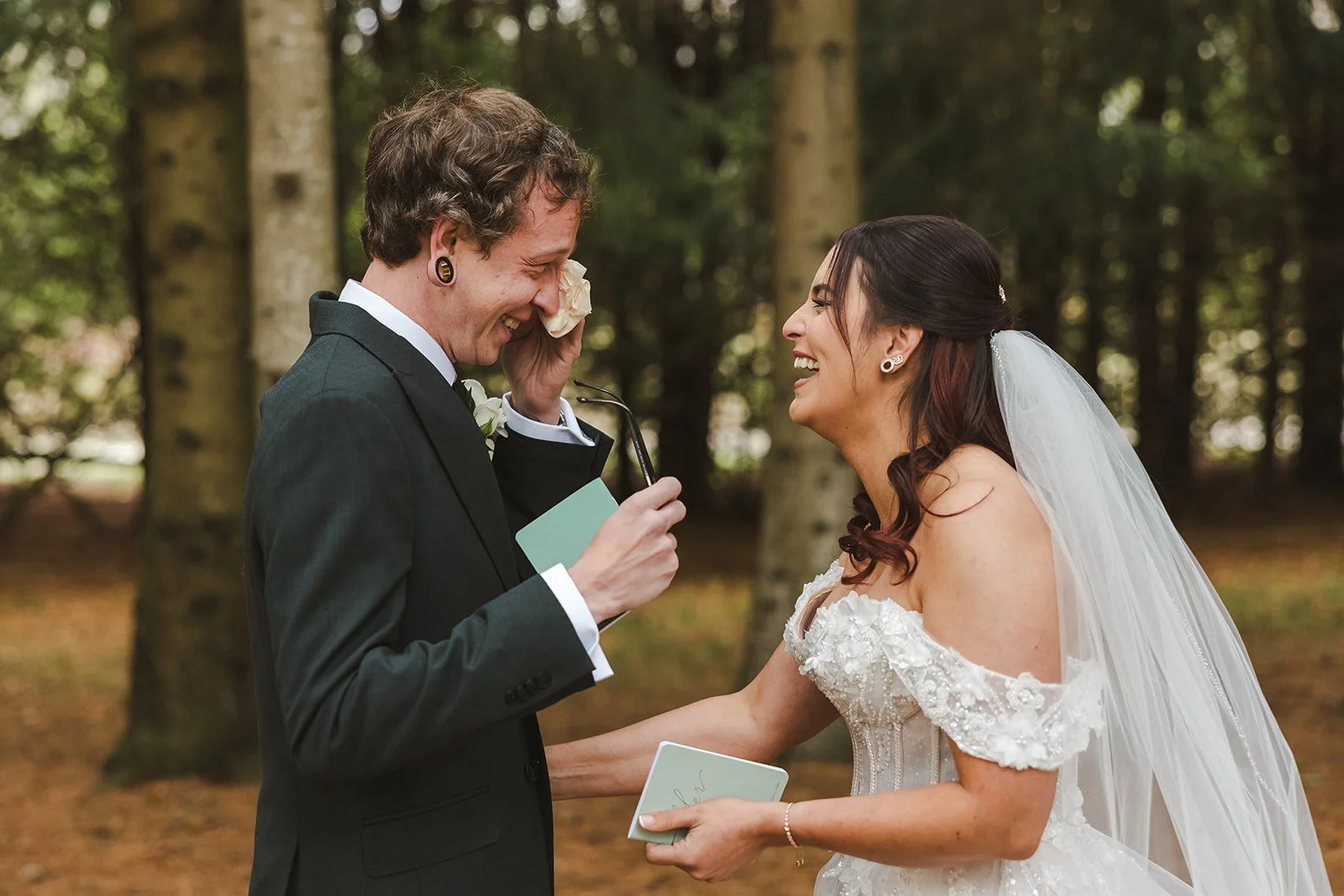 Groom wiping tears during reading of vows  Erin Estates  Fedora Media.jpg