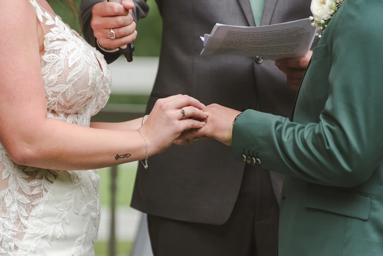 Bride and groom exchanging rings  Springfield Golf & Country Club  Fedora Media.jpg