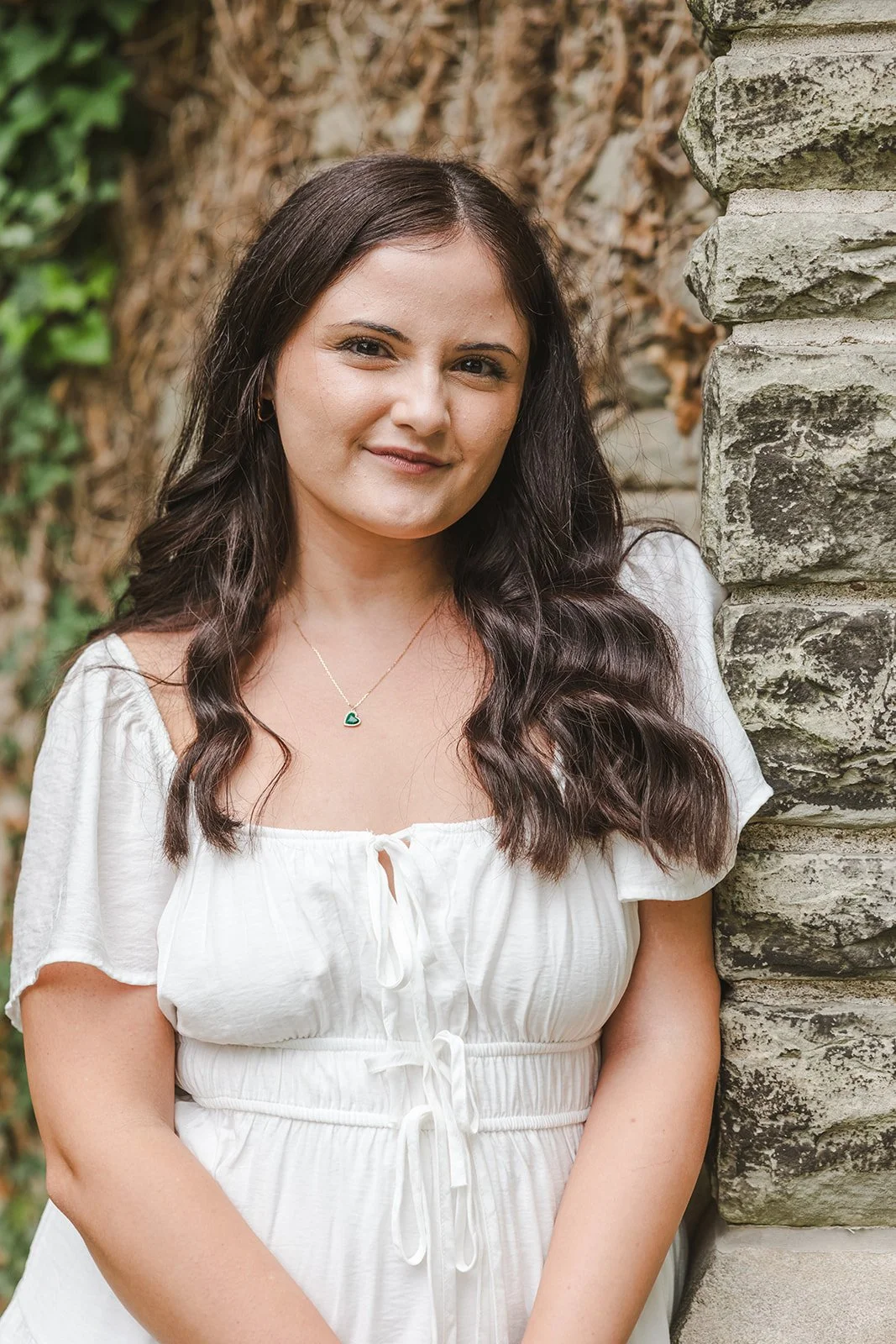 Woman in white dress with brown eyes  Fedora Media.jpg