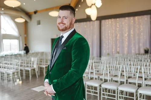 groom+in+green+suite+has+love+letter+for+bride+photo+by+Fedora+Media.webp