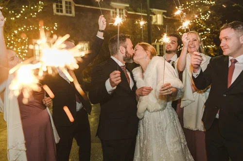 Winter+wedding+with+sparklers+at+the+Ancaster+Mill+photo+by+Fedora+Media.webp