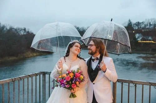 Cute+umbrella+picture+on+rain+wedding+day+photo+by+Fedora+Media.webp