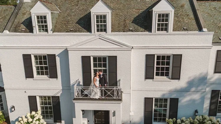 Drone+wedding+photo+on+the+balcony+at+Harding+Waterfront+Estate+photo+by+Fedora+Media.webp