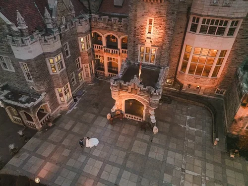 Bride+and+groom+dance+at+Castle+Loma+Toronto+drone+photo+by+Fedora+Media.webp