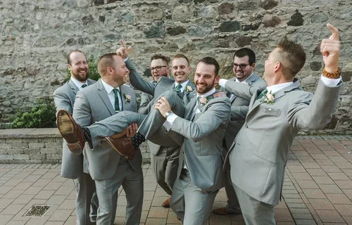 Groomsmen+pick+up+groom+to+celebrate+wedding+in+Paris+Ontario+photo+by+Fedora+Media+.webp
