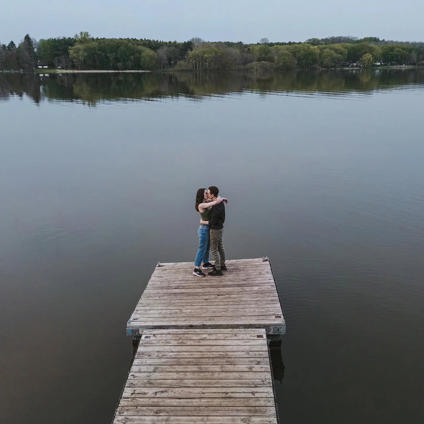 Their favourite lake, their favourite person, and a whole new perspective. 
We brought out the drone to capture this sweet moment on the dock, and we&rsquo;re still swooning! Who knew love looked even better from a bird's-eye view?

Thinking about bo