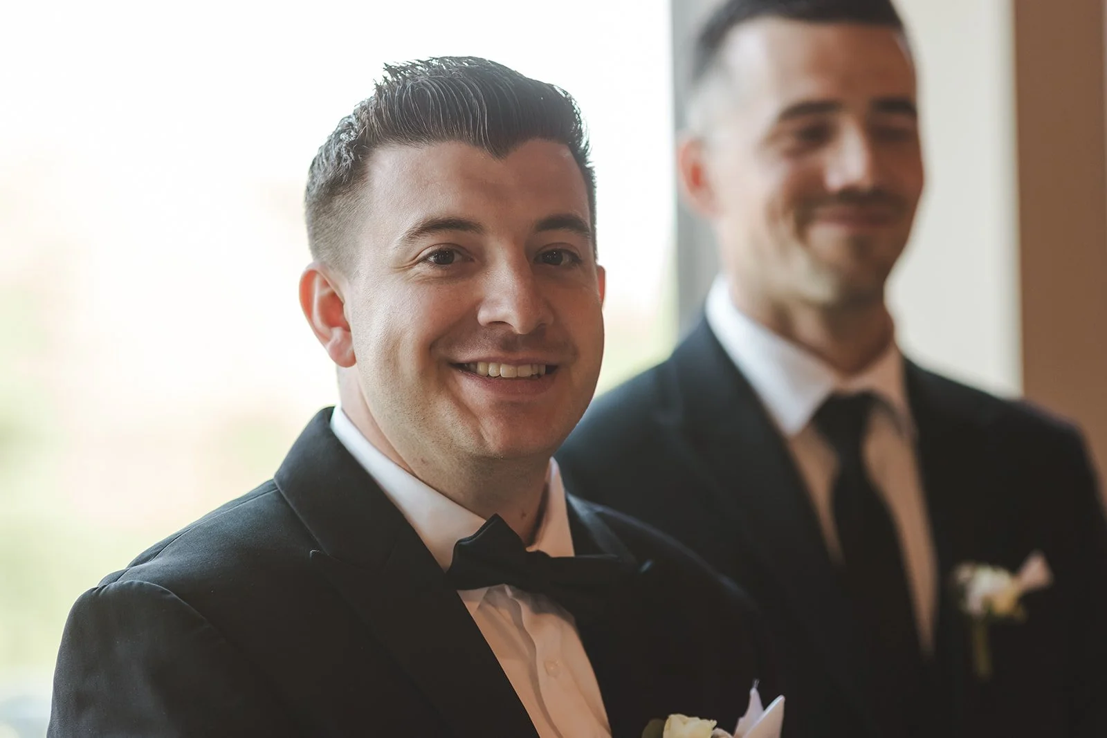 Groom smiling during wedding ceremony  Arlington Hotel  River's Edge  Paris, ON  Fedora media.jpg