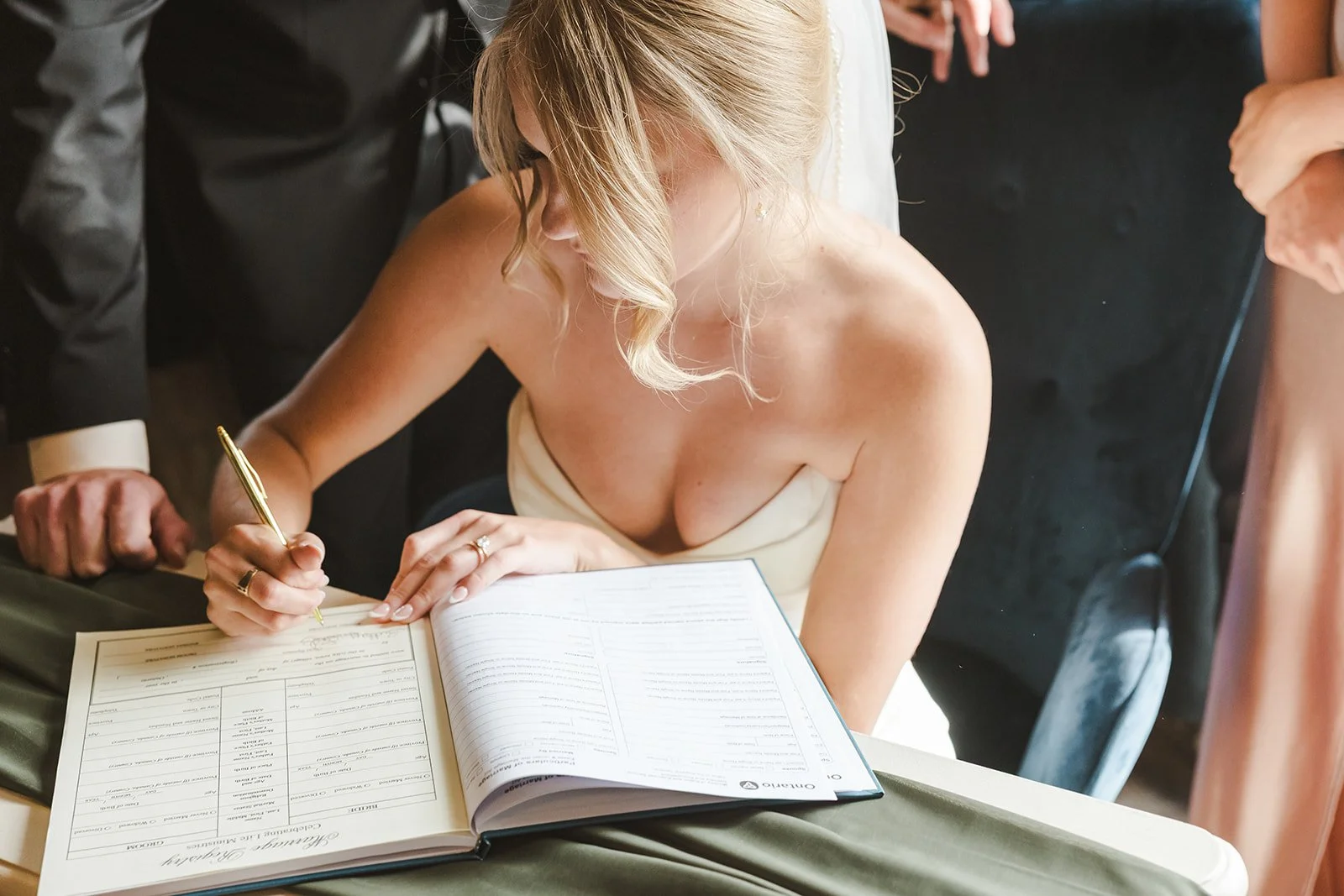Bride signing wedding certificate  Straford, ON  Fedora Media.jpg