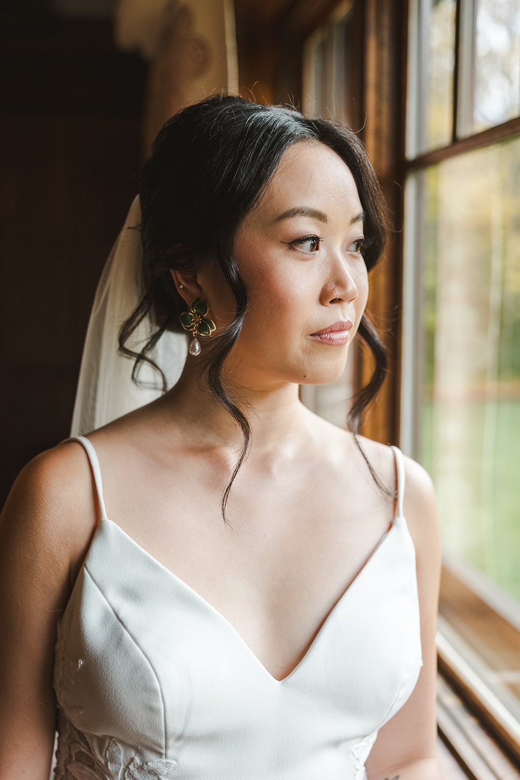 Bride looking out window  Erin Estates  Fedora Media.jpg