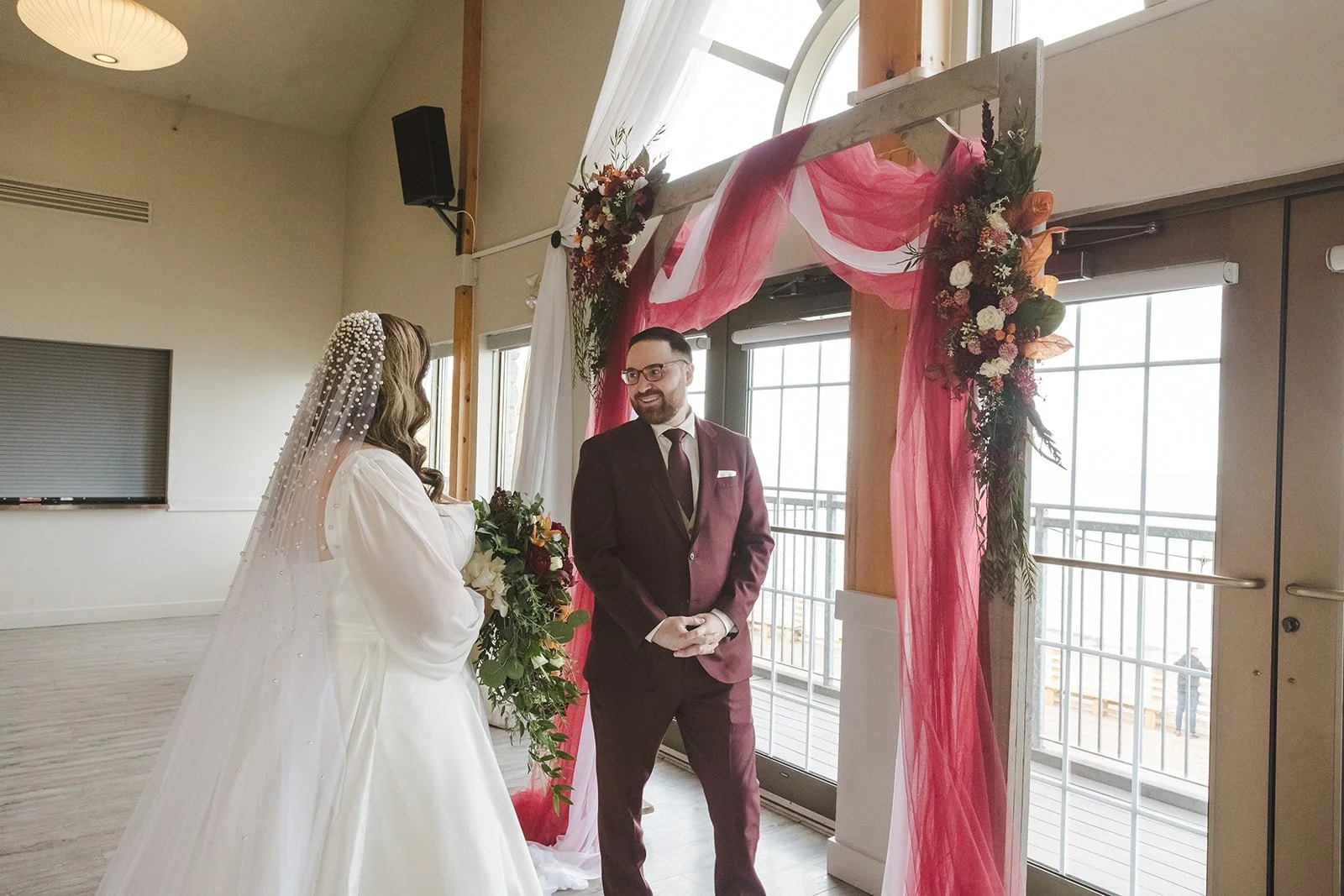 Groom at altar first look of bride  Lakeview By Carmens  Hamilton, ON  Fedora Media.jpg